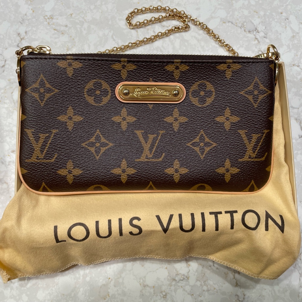 Louis Vuitton Monigram Pochette Mila Purse New with tags and box